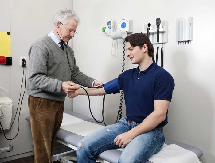 A truck driver getting a physical exam.