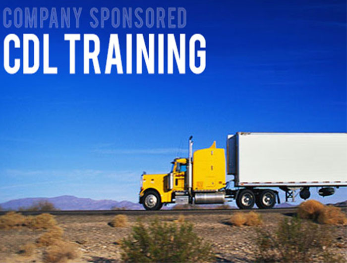 Yellow commercial truck driving in the desert.