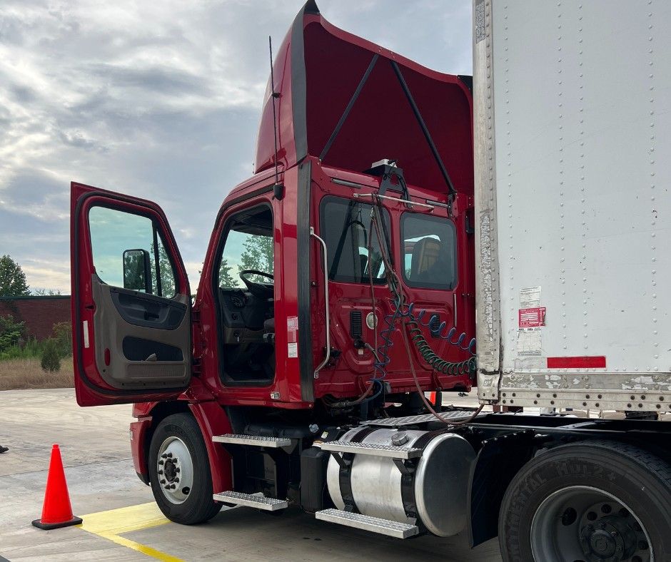 Red semi truck with cab door open