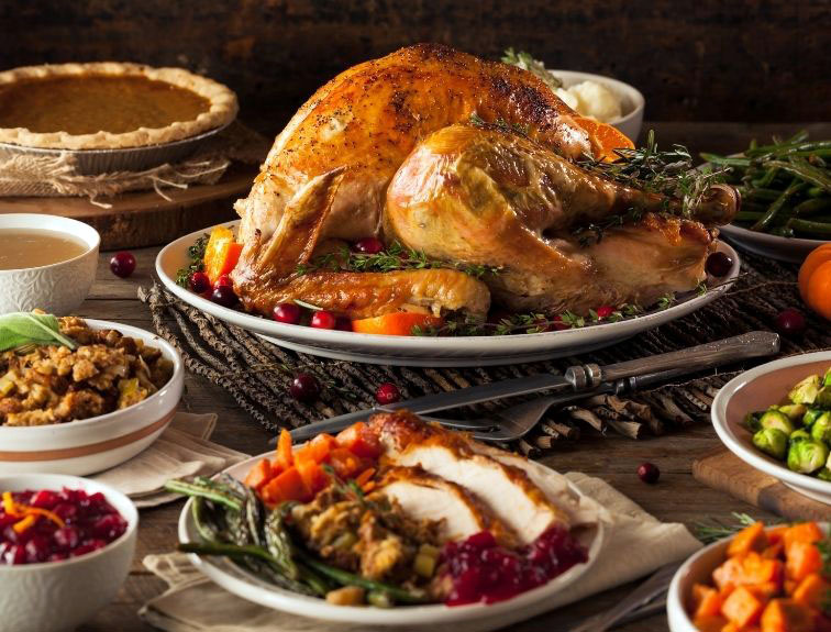 thanksgiving dinner with turkey, stuffing, pie, etc.