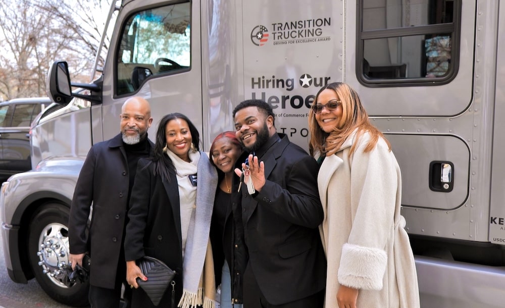 Charles and his family in front of new semi truck